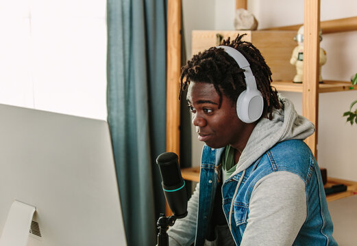 Podcaster chats into mic