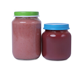 Glass jars with healthy baby food isolated on white