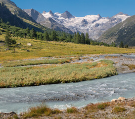 Fototapeta na wymiar Switzerland - The Roseg valley under the peaks Il Caputschin, La Muongia, Forcola Alta and Roseg Glacier.