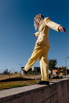 Carefree woman dancing on border