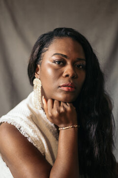 Studio portrait of an expressive black woman staring at camera