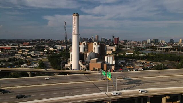 2022 - Excellent aerial footage of traffic driving past the Wheelabrator Incinerator on I-95 in Baltimore, Maryland.