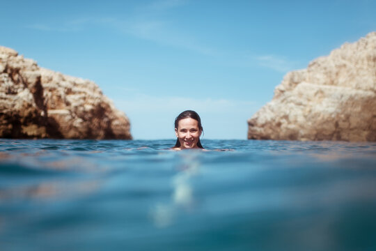 Happy woman swimming in the sea
