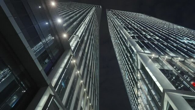 Low angle view of skyscrapers in city at night