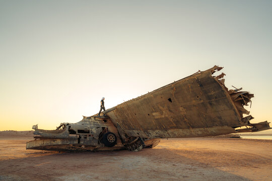 Man walking on a crashed plane