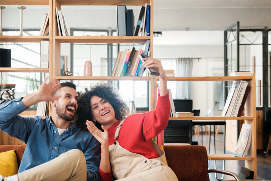 Happy friends taking selfie with phone