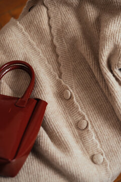 Close up of a sweater and a bag