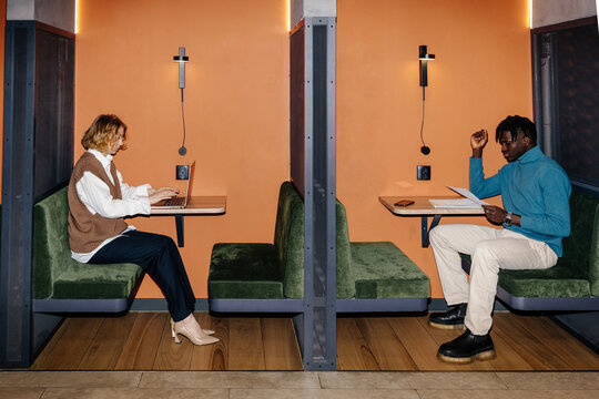 Diverse employees working in cubicles