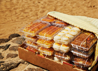Box of Hawaiian Style pastries and noodles being sold at the Beach
