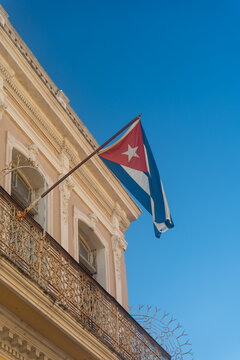 Cuban Flag Waving Outside A Balcony