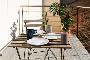 Empty breakfast dishes in the balcony