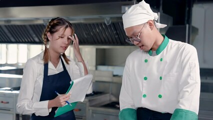 4K, Beautiful asian student who learns cook become a future chef, standing and learning prepare ingredients with a chef who specializes in all types of food both practice and theory.