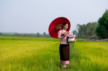 Pretty Asian women in traditional Thai dress. Beautiful traditional Thai dresses by Asian Buddhists...