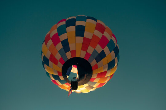 Hot Air Balloon Among Bright Blue Sky