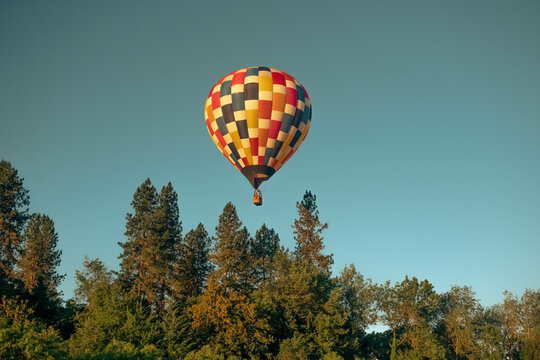 Hot Air Balloon Among Bright Blue Sky