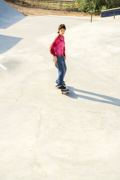 Teen girl posing in a skate park 