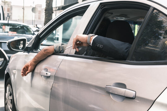 arm of a man on an Uber cab