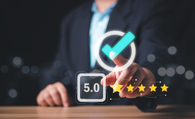 Businessman hand touching check mark and 5 star sign of the top service Quality assurance,...