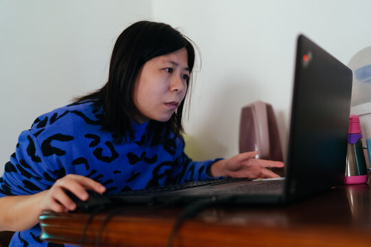woman working from home using laptop