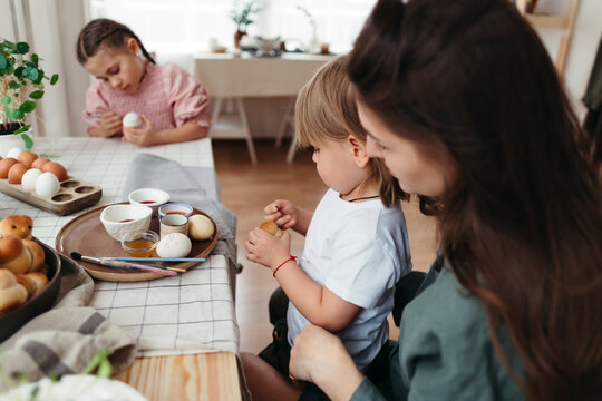 Family decorating home for Easter celebration.