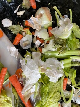messy vegetable peels on counter top  