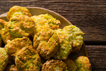 homemade baked scone cakes from fresh ramson leaves and cheese, old wooden texture