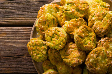homemade baked scone cakes from fresh ramson leaves and cheese, old wooden texture