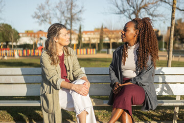 multiracial women of different generations outdoors