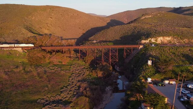 2023 - Excellent aerial footage of an Amtrak train crossing a railroad bridge in Lompoc, California.