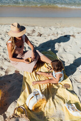 Fototapeta premium Mother and Daughter on the Beach