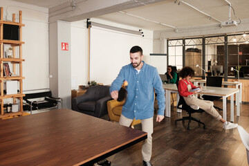 Office worker playing ping pong during a break