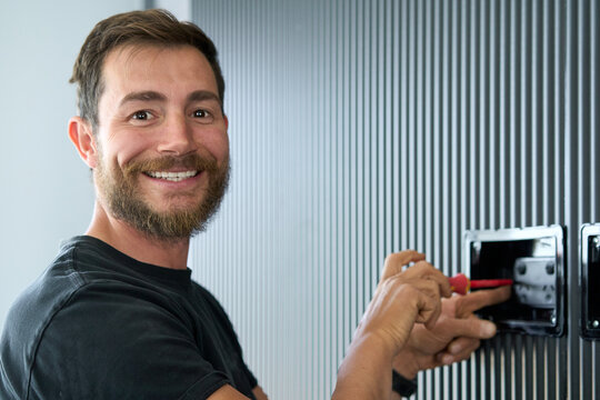 Electrician smiling into camera