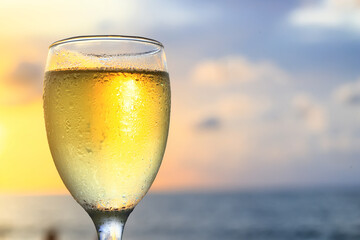 a glass of white wine in a restaurant, alcohol luxury background