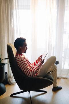 Man Using Digital Tablet at Home