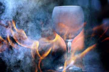 grill bar fire alcohol, glass background, mulled wine hot cocktail