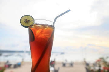 iced tea with ice and lemon at the beach bar
