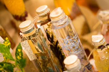 bottles of essential oil and flowers