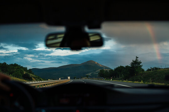 Fototapeta View of a mountain with a rainbow on the sky