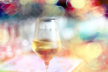 white wine tasting, chilled ice wine in a cold glass in summer