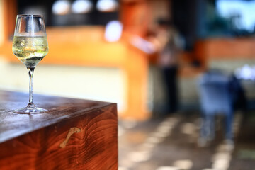 white wine tasting, chilled ice wine in a cold glass in summer