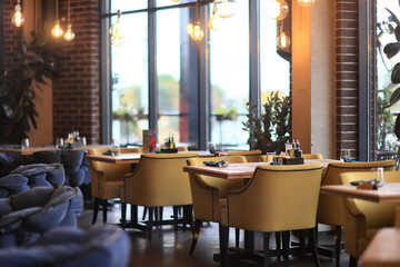 Fototapeta na wymiar table setting in the restaurant for the cafe interior menu