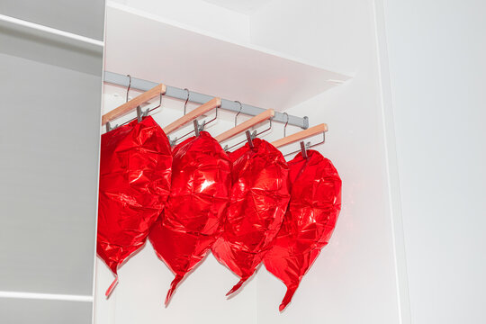 Conceptual still life with heart-shaped balls in the closet