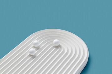 White concrete ribbed panel with little balls.