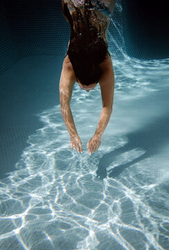 Woman Dives in Water 