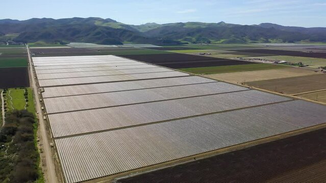 2023 - Excellent aerial footage of covered crops on farmland in Lompoc, California.