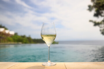 white wine tasting, chilled ice wine in a cold glass in summer