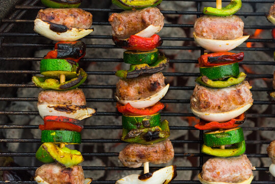 Sausage skewers on a grill