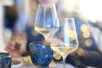 white wine tasting, chilled ice wine in a cold glass in summer