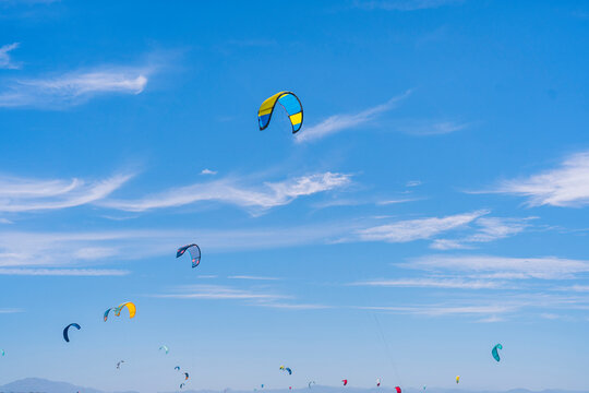 Colorful power kites in blue sky