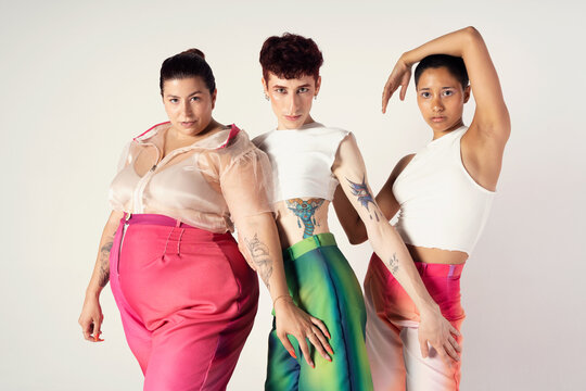 Shot of three young people posing together in studio